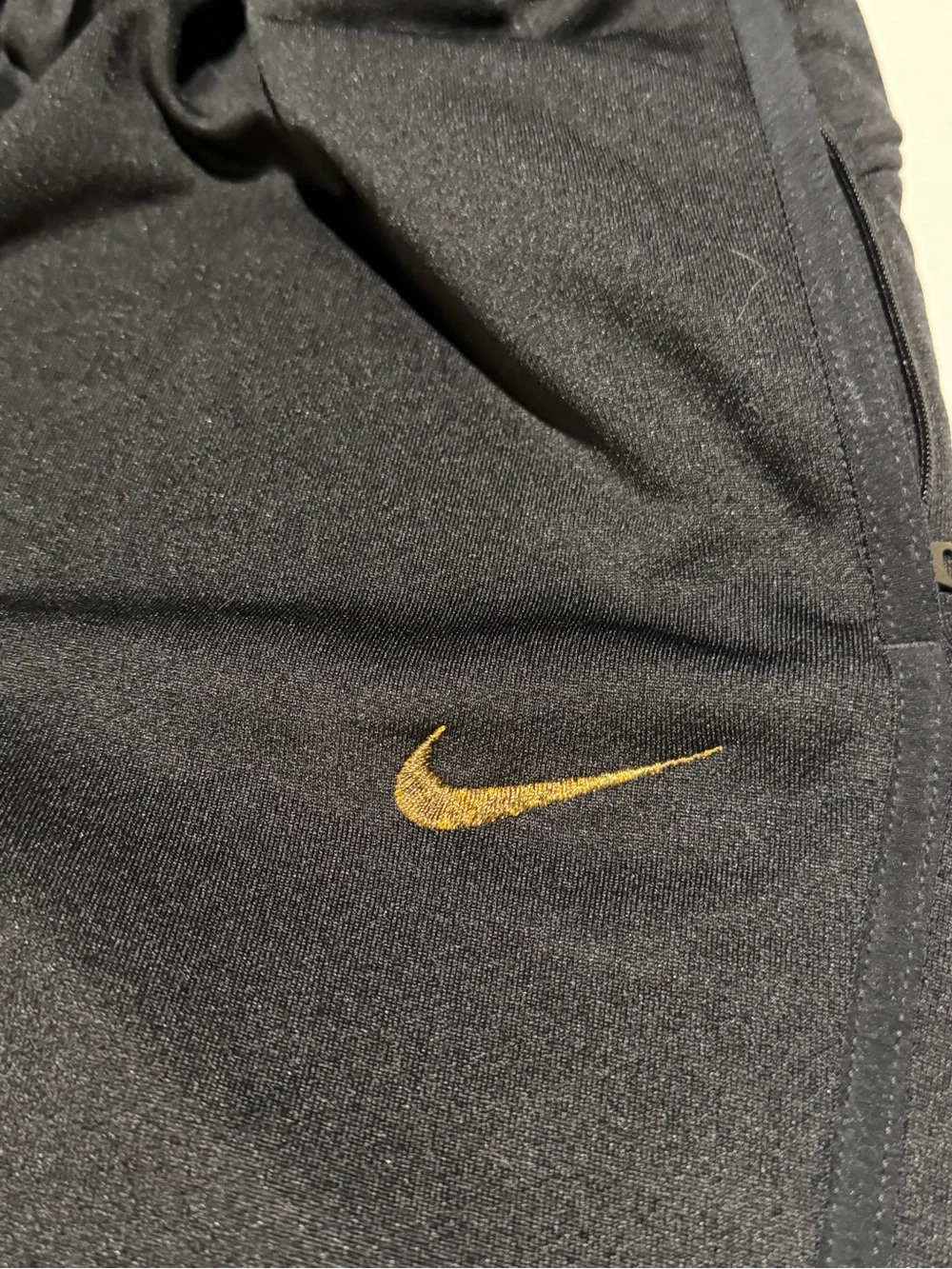Nike Black Joggers with Yellow Side Stripe and Gold Swoosh